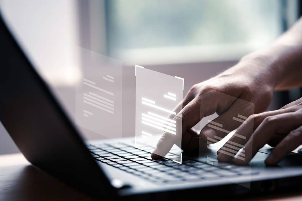 hand-using-laptop-computer-with-virtual-screen-document-online-approve-paperless-quality-assurance-erp-management-concept - Cross-Connection Control Program | Backflow Prevention - HydroCorp