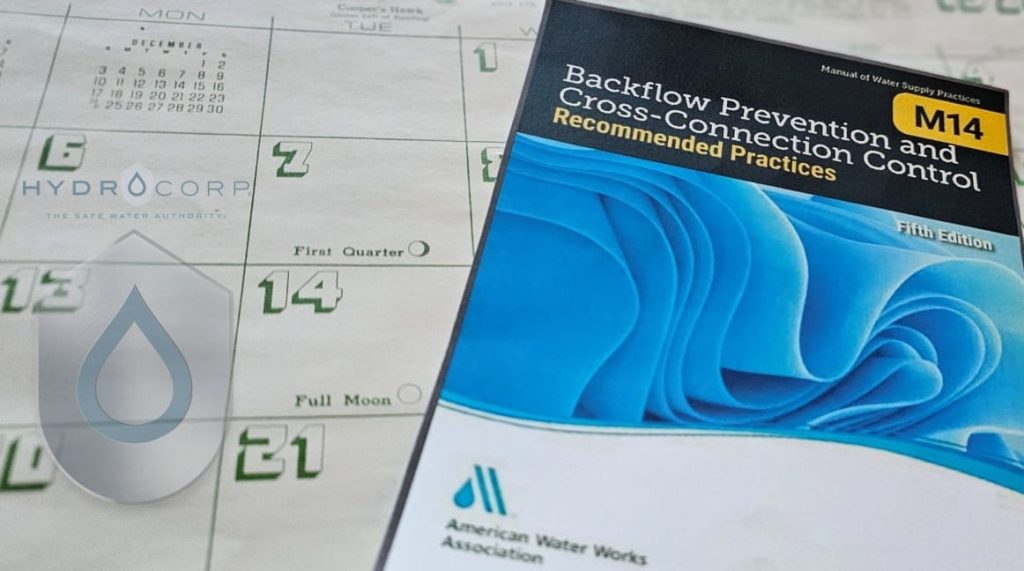 M14 manual on calendar with Hydro logo - HydroCorp M14 manual on calendar with Hydro logo - Safeguarding Our Water: A Weeklong Journey Through Cross-Connection Control Programs - HydroCorp - HydroCorp