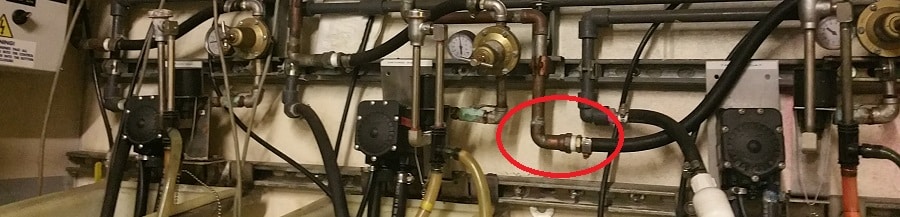 Piping-with-red-circle - Money Talks: The Impact of Pipe Labeling & System Schematics on Revenue - HydroCorp - HydroCorp