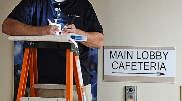 med-gas-hospital-surveyor-on-ladder - HydroCorp med-gas-hospital-surveyor-on-ladder - 10 Steps to Preserving Hospital Legacy Knowledge of Piping Infrastructure - HydroCorp - HydroCorp